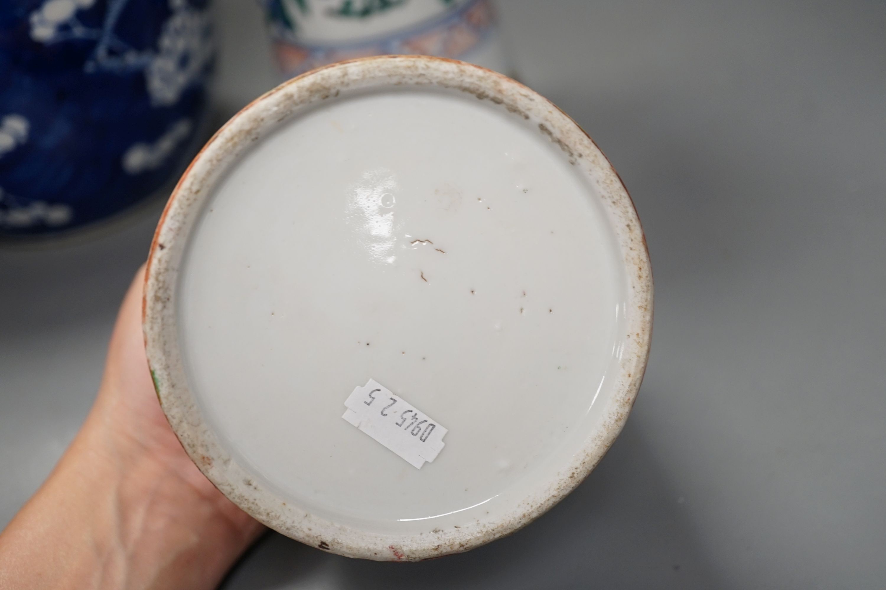 A Chinese prunus jar and cover, a polychrome vase and a famille rose jar, 24cms high.